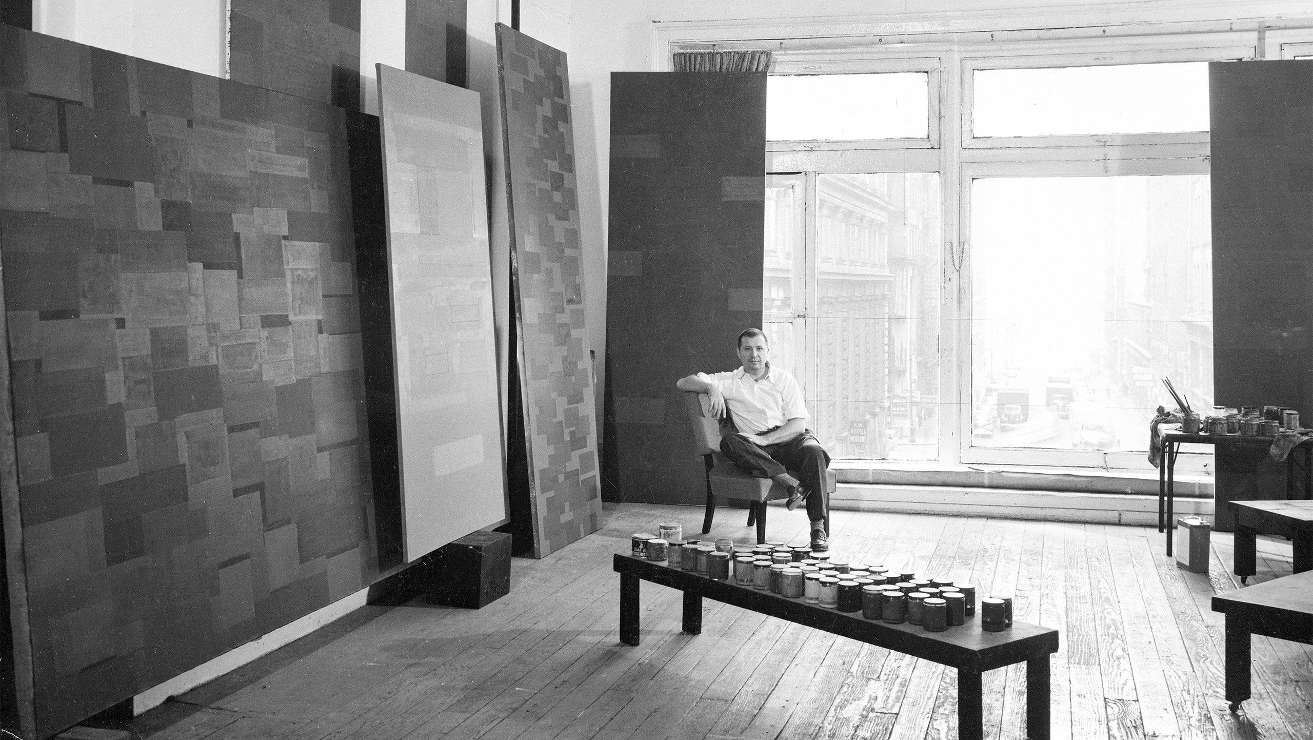 A photograph of Ad Reinhardt in his studio by Walter Rosenblum, dated 1953.